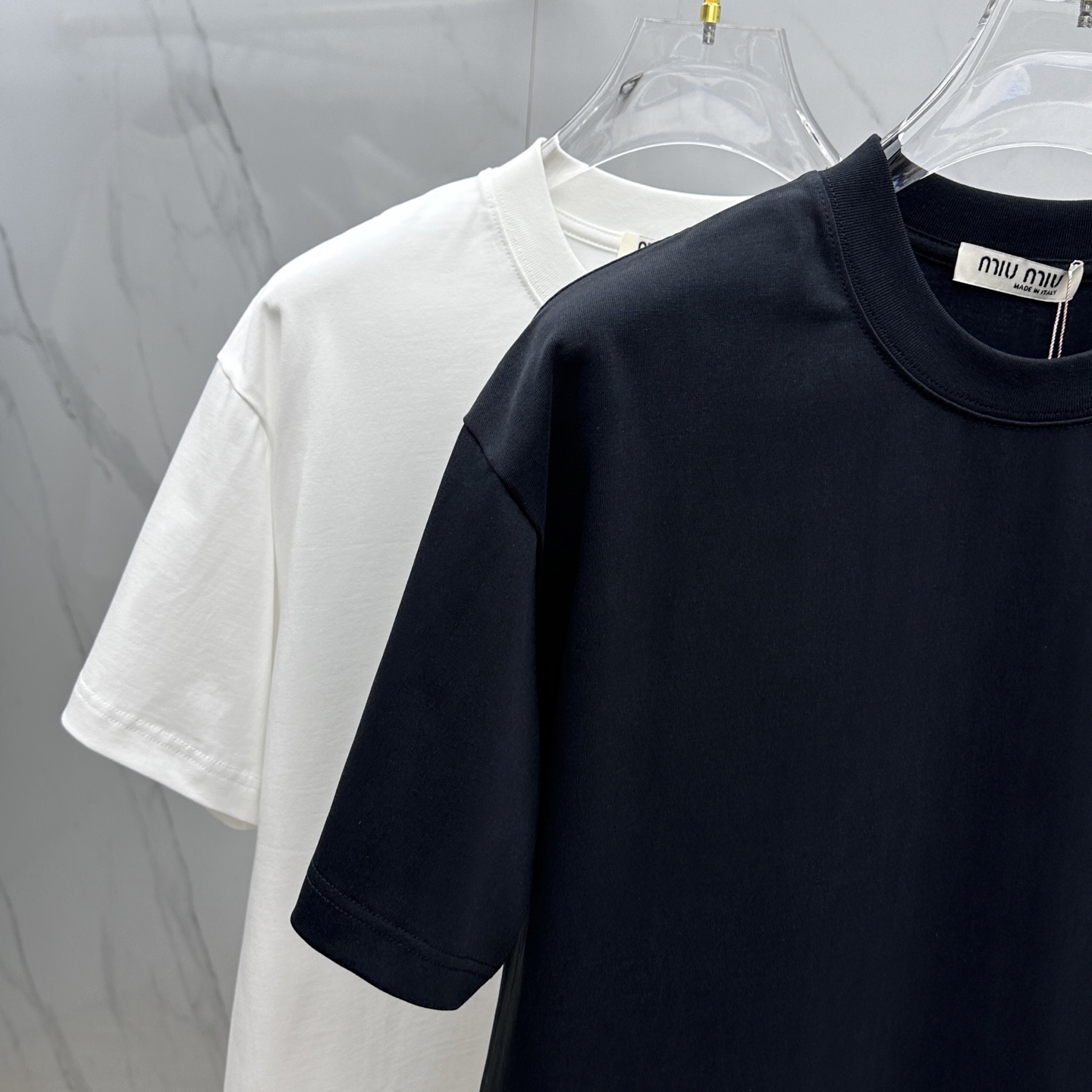 Miu Miu T-Shirt: Spring/Summer Crewneck Tee with Embossed Logo 4 i1744221191517 2967 0 2
