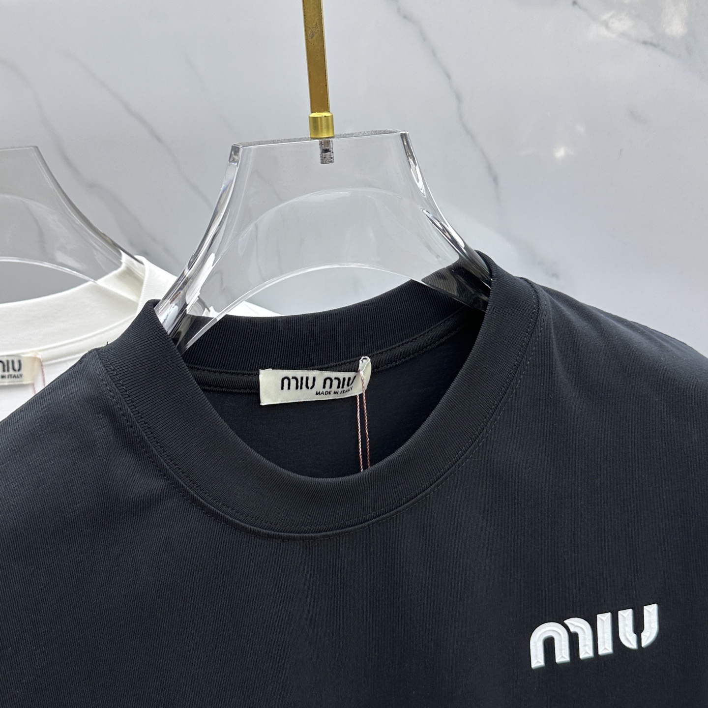 Miu Miu T-Shirt: Spring/Summer Crewneck Tee with Embossed Logo 5 i1744221193141 5430 0 3