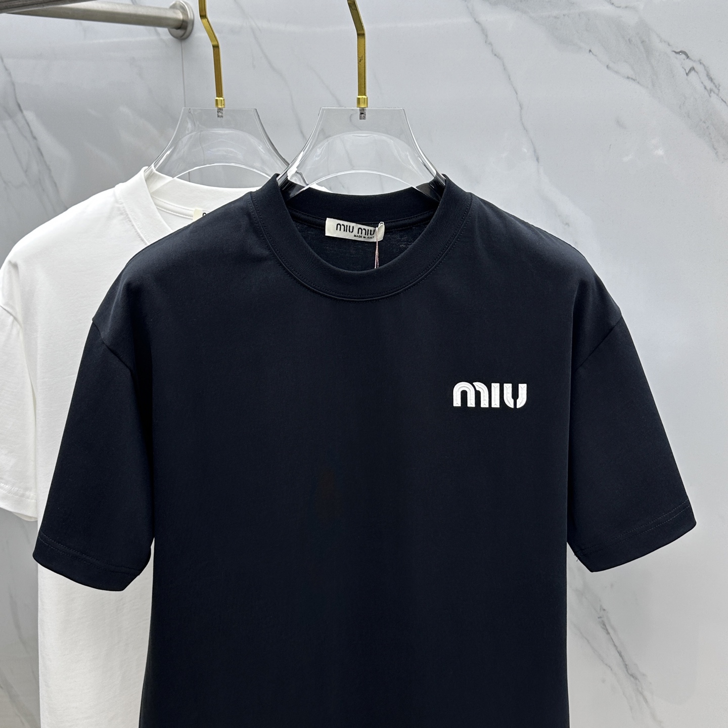 Miu Miu T-Shirt: Spring/Summer Crewneck Tee with Embossed Logo 3 i1744221193200 7253 0 1