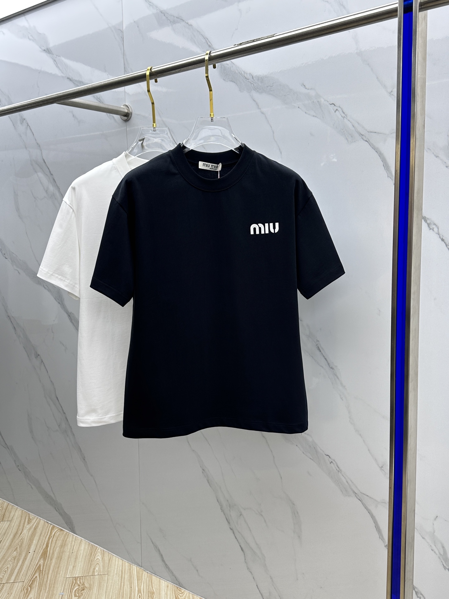 Miu Miu T-Shirt: Spring/Summer Crewneck Tee with Embossed Logo 2 i1744221193298 3659 0 0
