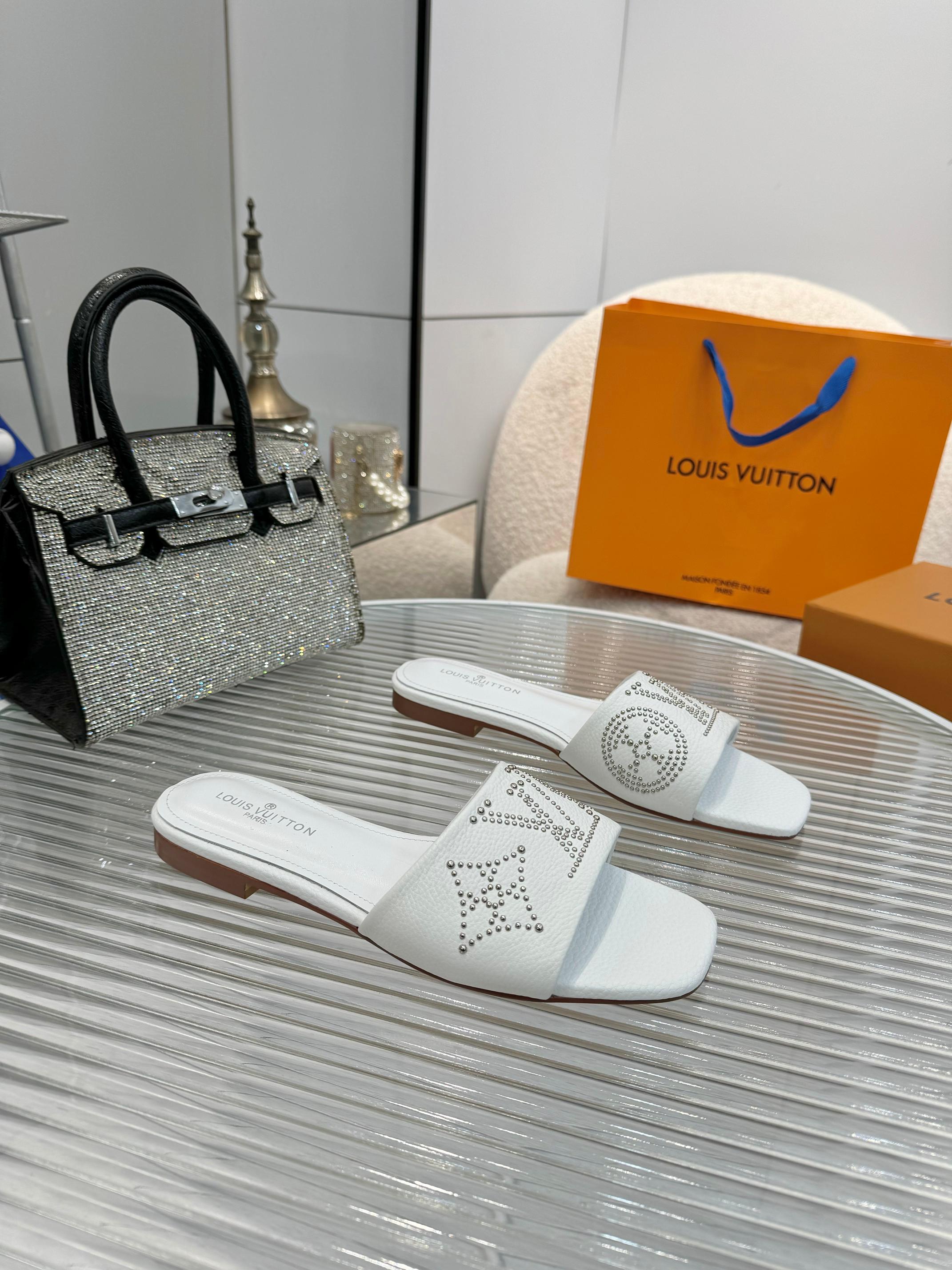 Louis Vuitton Women's White Leather Studded Logo Flat Sandals Slides 4 a1742621358621 1838