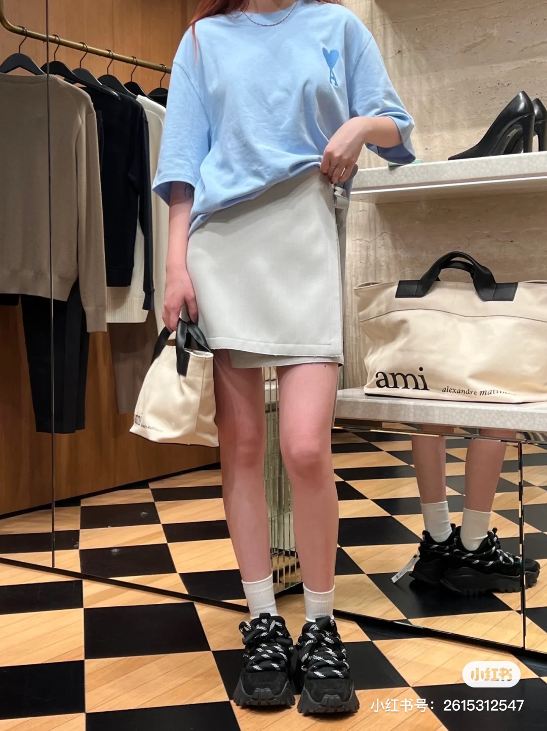 A versatile, minimalist AMI handbag presented in soft off-white - Comprehensive 3