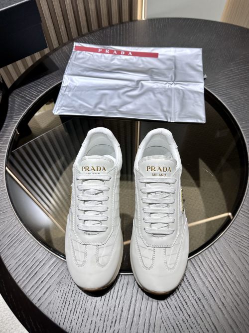 Prada Suede Low-Top Sneakers with Embossed Logo, Light Weight Rubber Sole 1 Prada Suede Low-Top Sneakers with Embossed Logo, Light Weight Rubber Sole