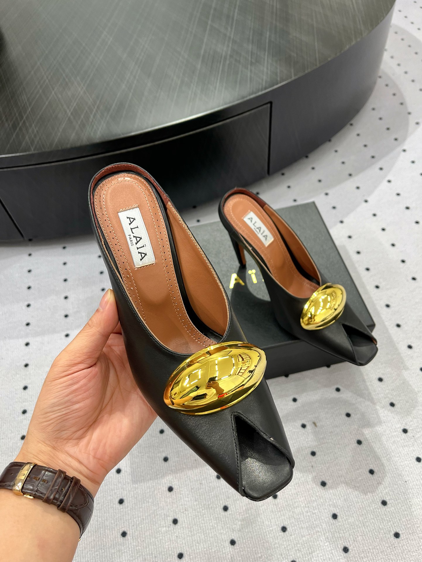 Alaïa Elegant Leather Heeled Mules with Golden Embellishment 7 i1717061277 8493 1