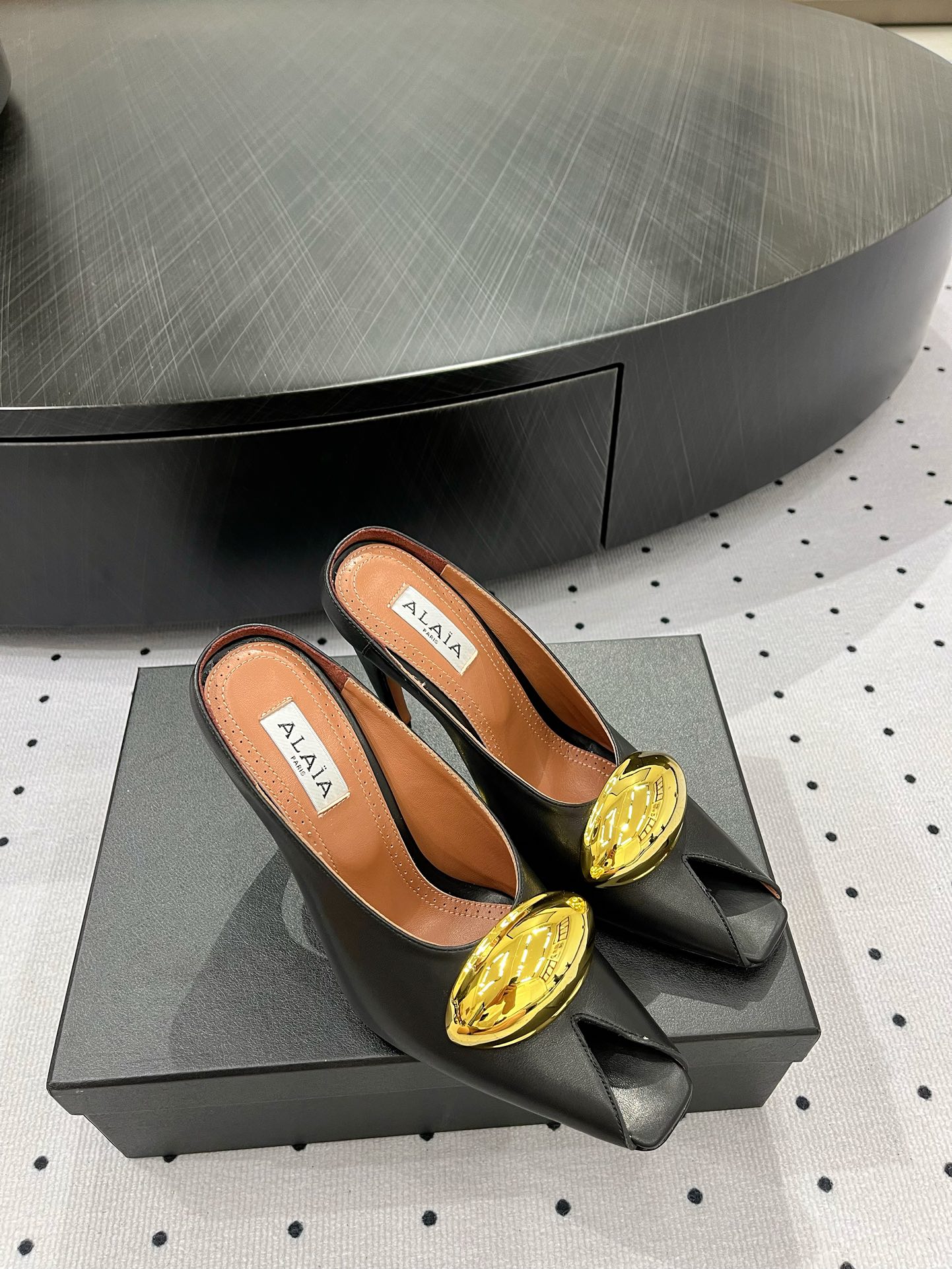 Alaïa Elegant Leather Heeled Mules with Golden Embellishment 1 Alaïa Elegant Leather Heeled Mules with Golden Embellishment