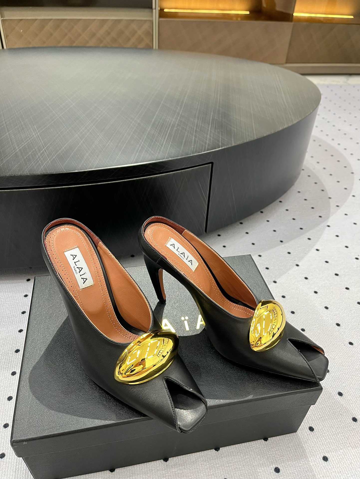 Alaïa Elegant Leather Heeled Mules with Golden Embellishment 5 i1717061278 9689 4