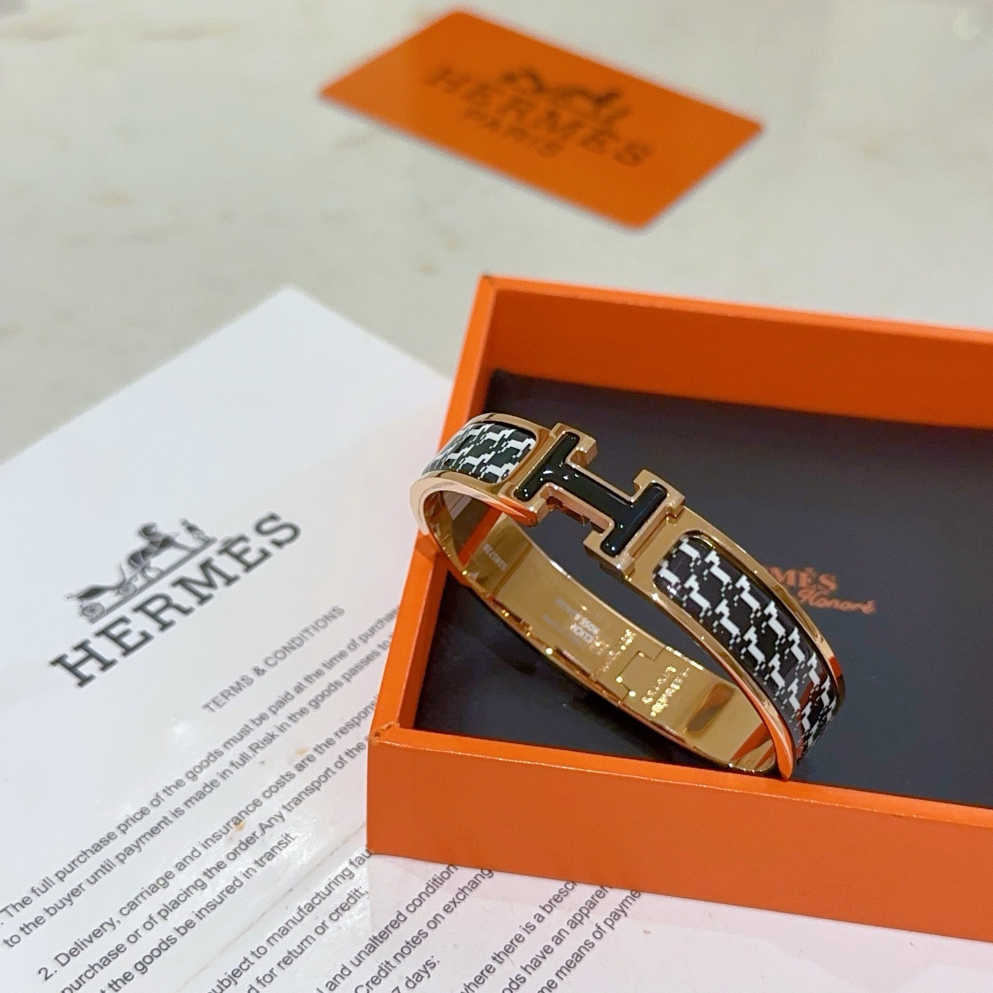 Hermes Clic H bracelet rose gold plated metal with black and white houndstooth enamel black enamel H clasp PM