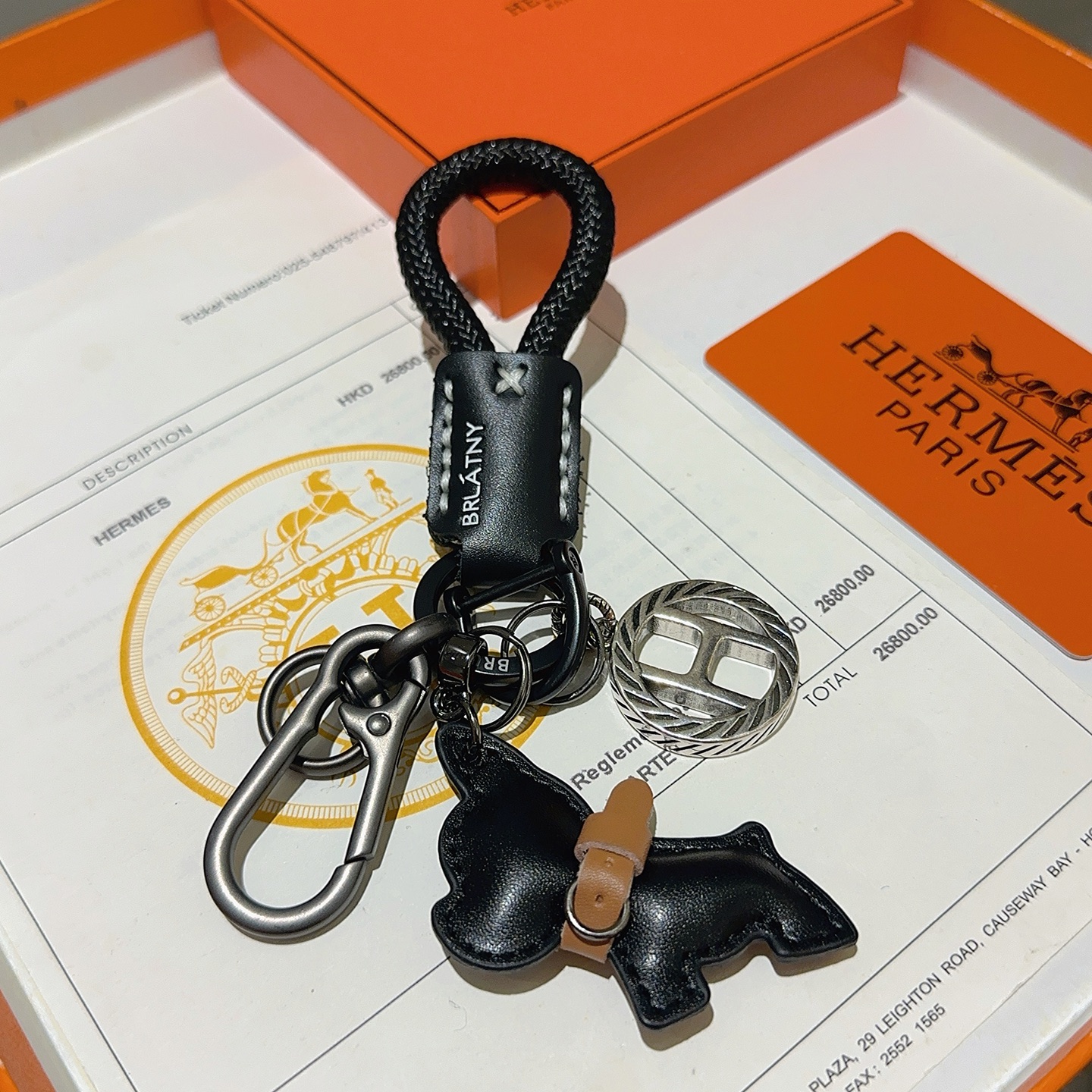 Hermes H Logo Bulldog Charm Keychain pendant gunmetal silver metal black braided cord black leather tan leather accent 10cm total length