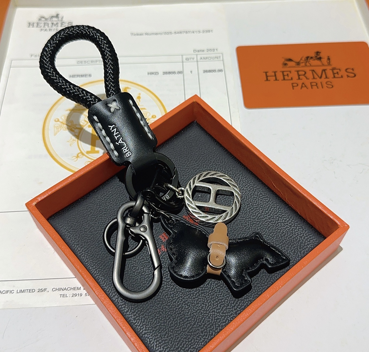 Hermes H Logo Bulldog Charm Keychain pendant gunmetal silver metal black braided cord black leather tan leather accent 10cm total length