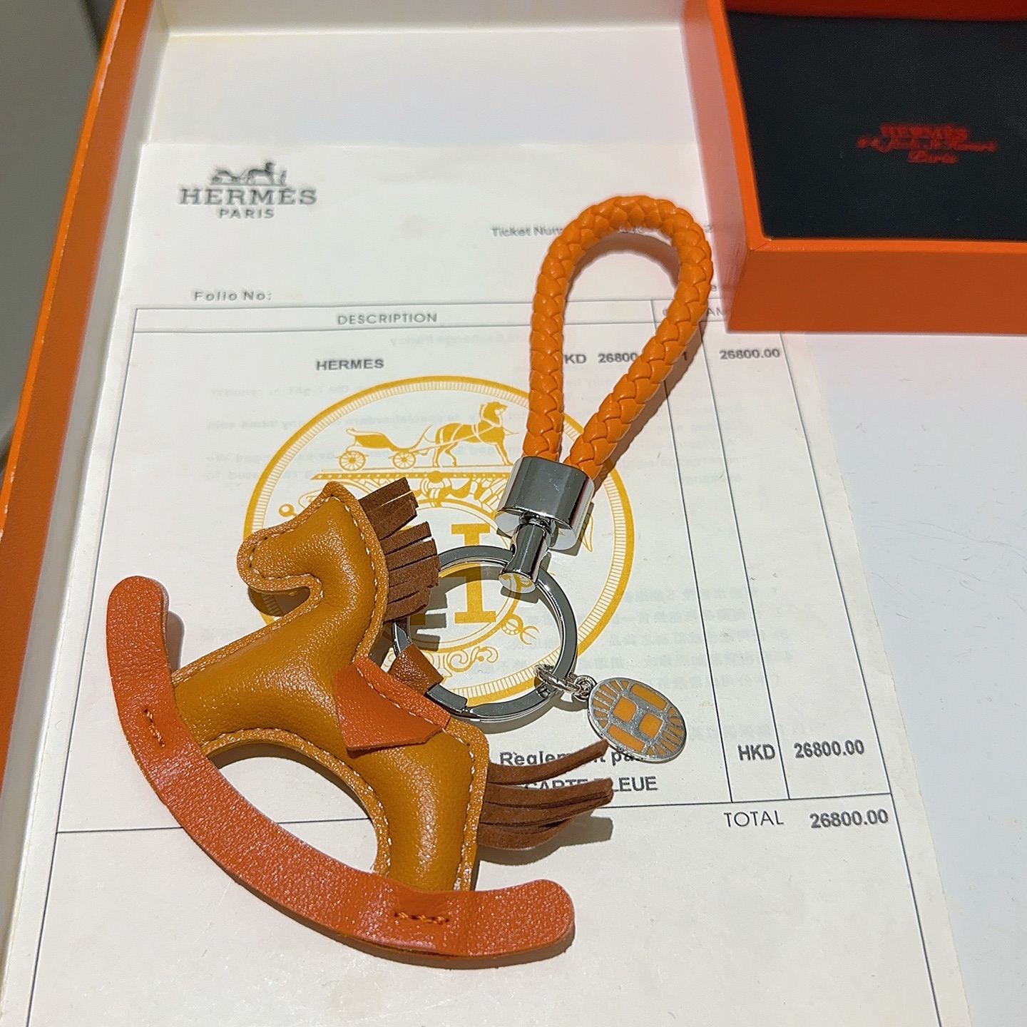 Hermes Rodeo Rocking Horse Bag Charm Llavero colgante Metal en tono plateado Cuero naranja y tostado Detalles de cuero marrón 10 cm Correa trenzada 5 cm