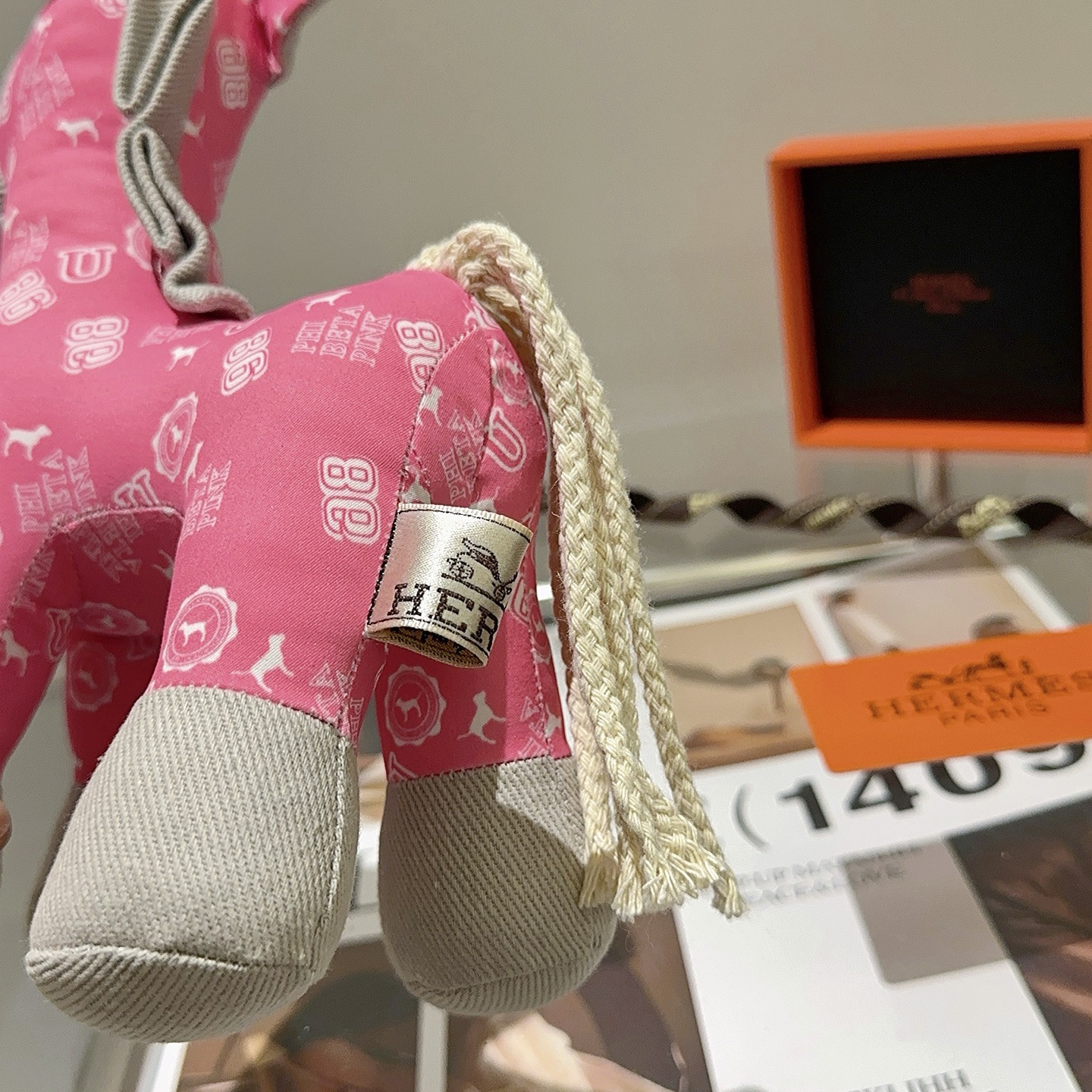 Hermes Hermes Plush Horse Charm pendant Pink fabric with white print light gray fabric accents cream rope tail brass-toned metal eye detail 35cm