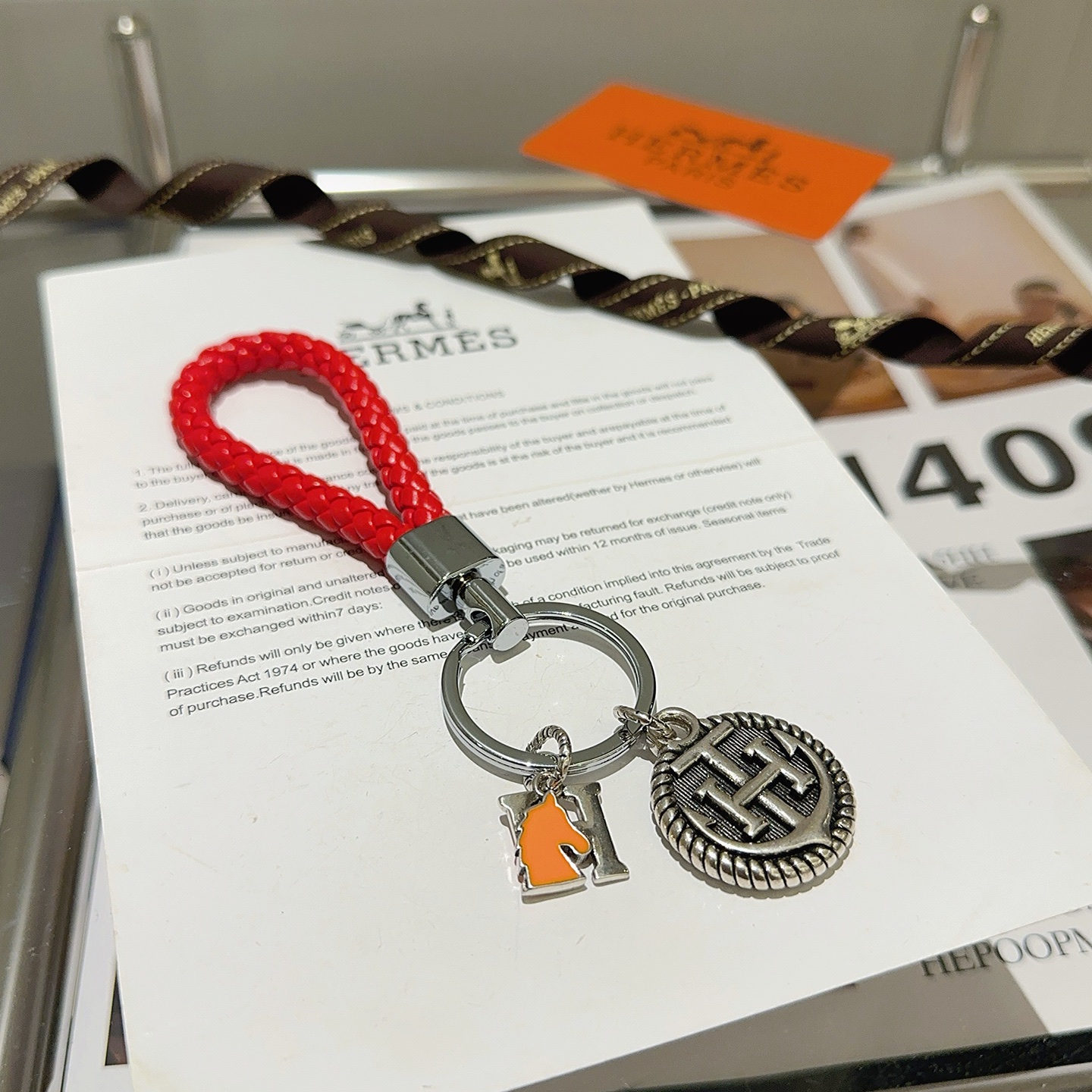 Hermes H Logo Anchor Braided Keychain pendant Red braided leather silver-tone metal orange enamel 10cm total length