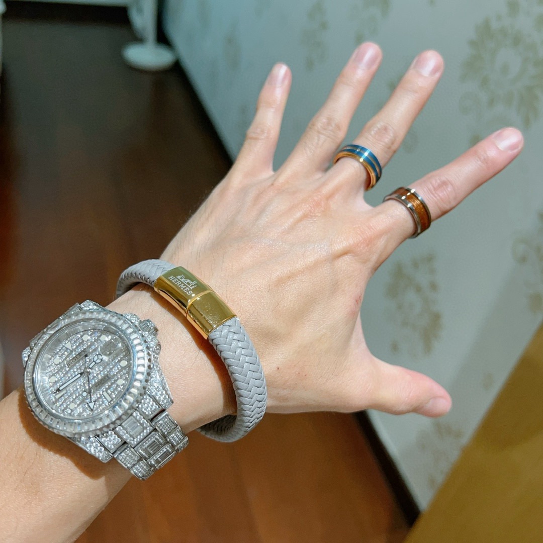 Bracciale Hermes New H in pelle intrecciata grigia con chiusura in metallo placcato oro 19 cm