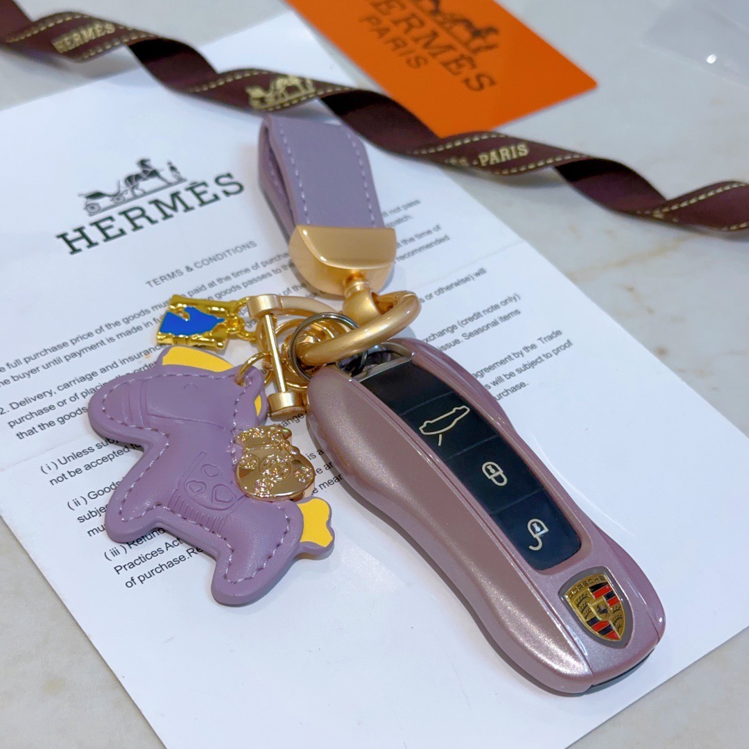 Hermes Rodeo Pony Charm Keychain pendant Lavender purple leather with gold tone metal yellow and blue enamel accents 10cm total length