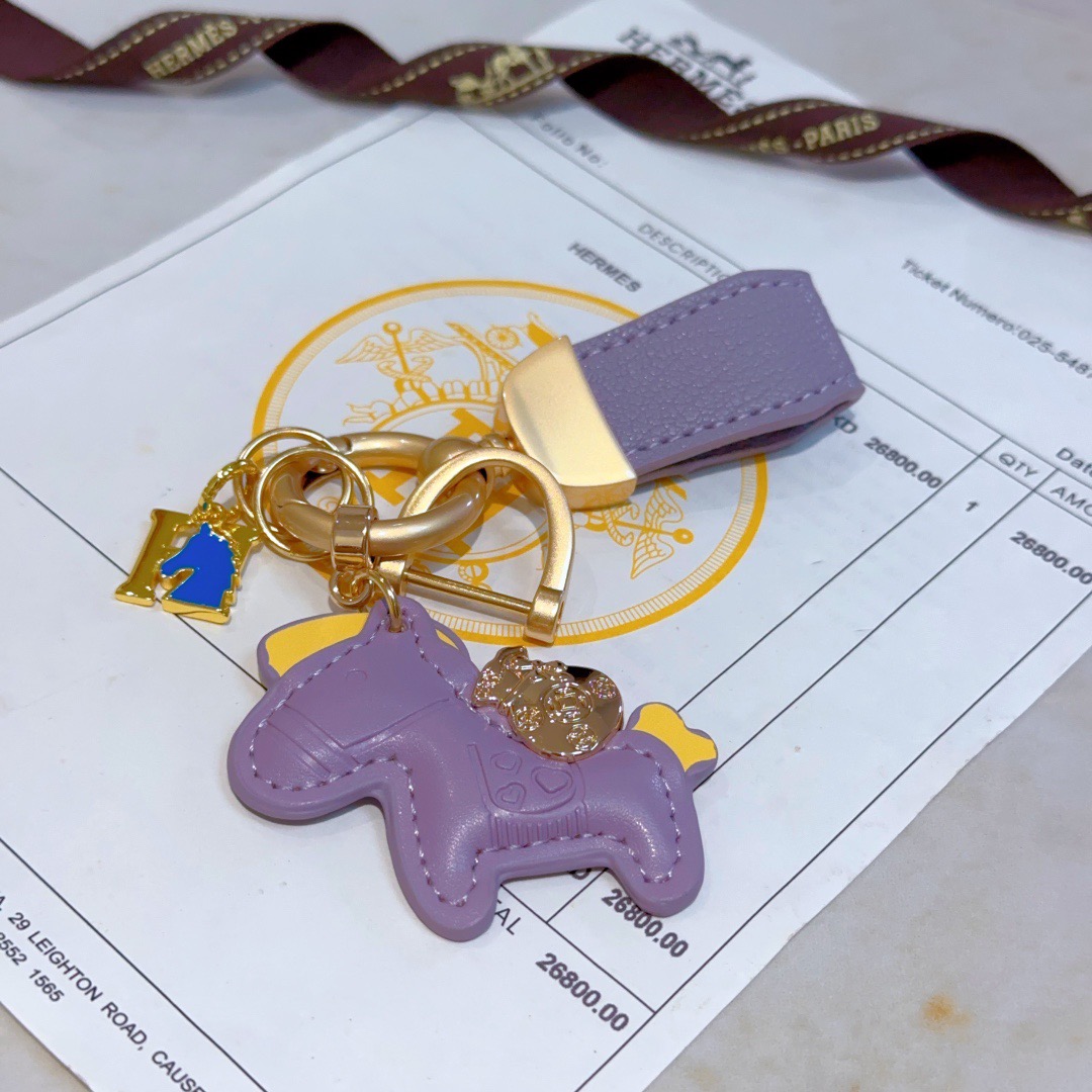 Hermes Rodeo Pony Charm Keychain pendant Lavender purple leather with gold tone metal yellow and blue enamel accents 10cm total length