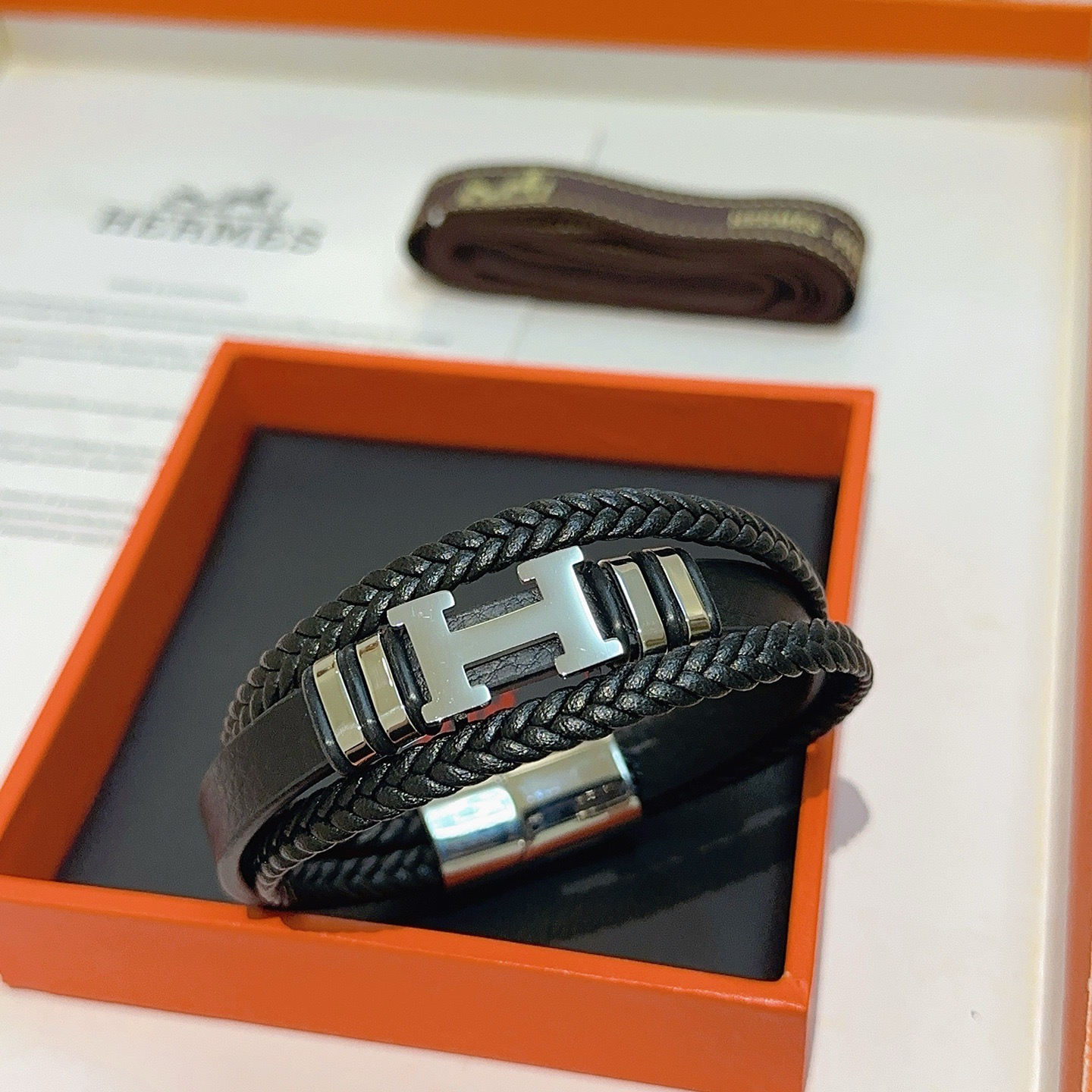 Hermes New Anger Forest H Logo Braided Leather Bracelet bracelet Black braided leather silver-tone palladium plated metal hardware 19cm