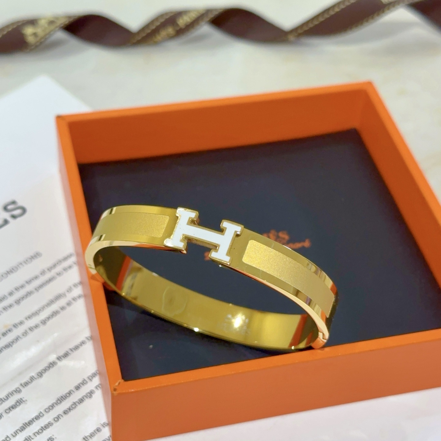 Hermes Clic H bracelet gold plated metal with white enamel PM