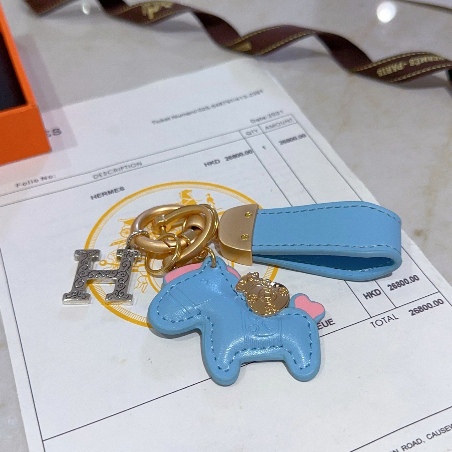 Hermes Rodeo Horse H Logo Key Charm pendant Light blue leather matte gold hardware silver-tone H charm pink accent details 8cm total length