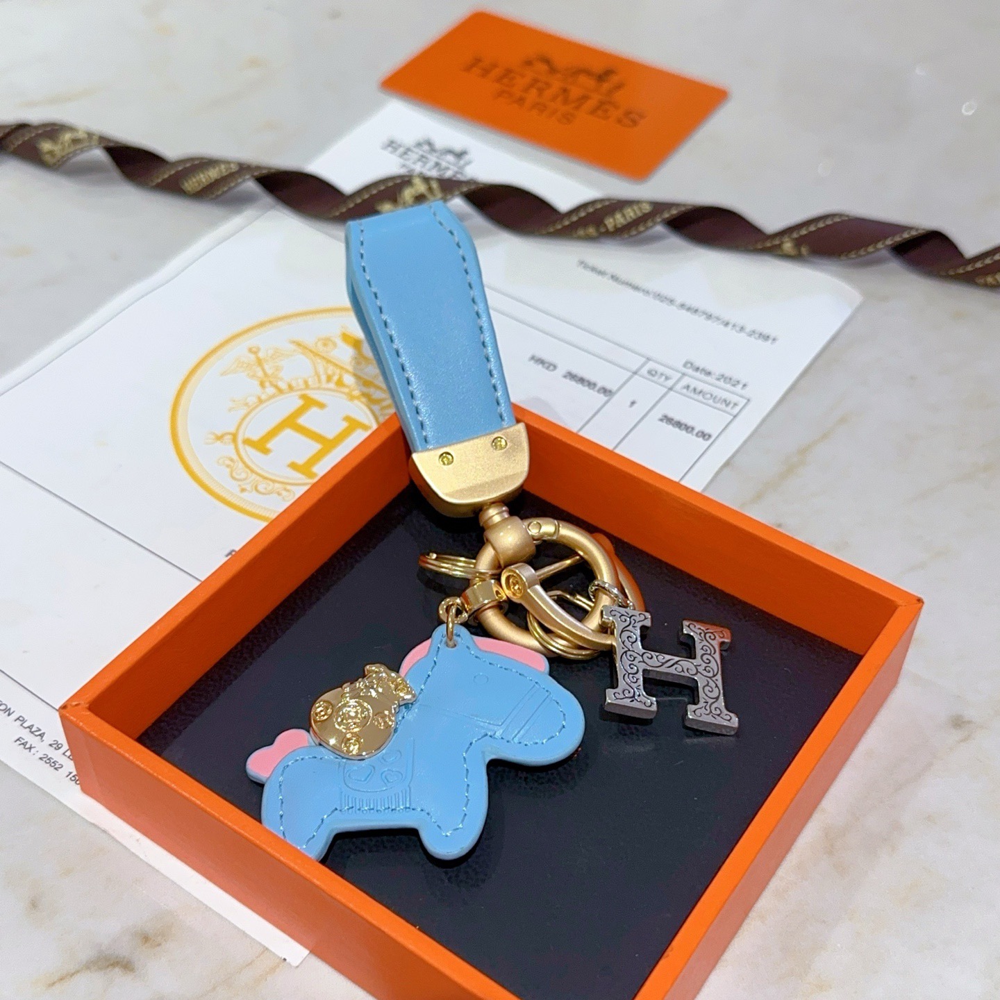 Hermes Rodeo Horse H Logo Key Charm pendant Light blue leather matte gold hardware silver-tone H charm pink accent details 8cm total length