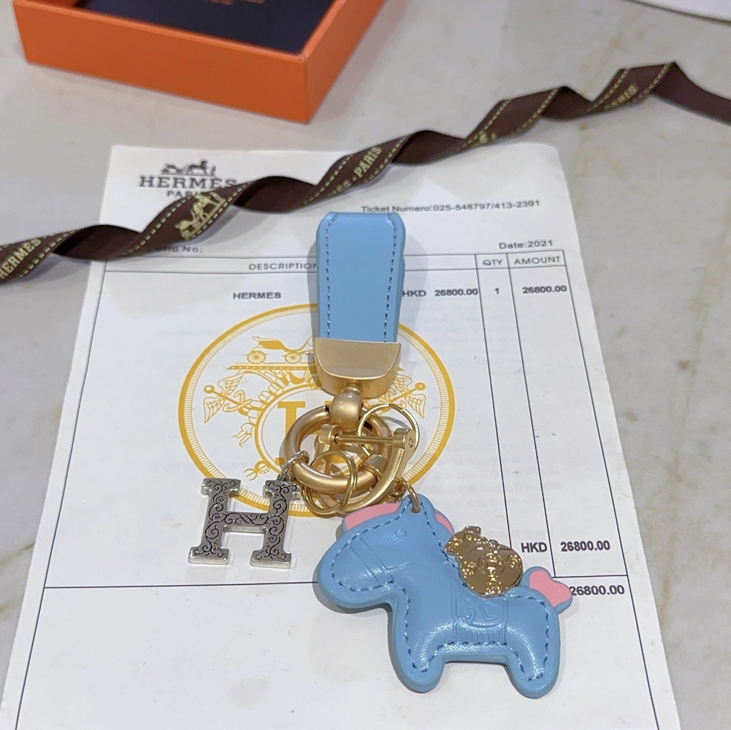 Hermes Rodeo Horse H Logo Key Charm pendant Light blue leather matte gold hardware silver-tone H charm pink accent details 8cm total length