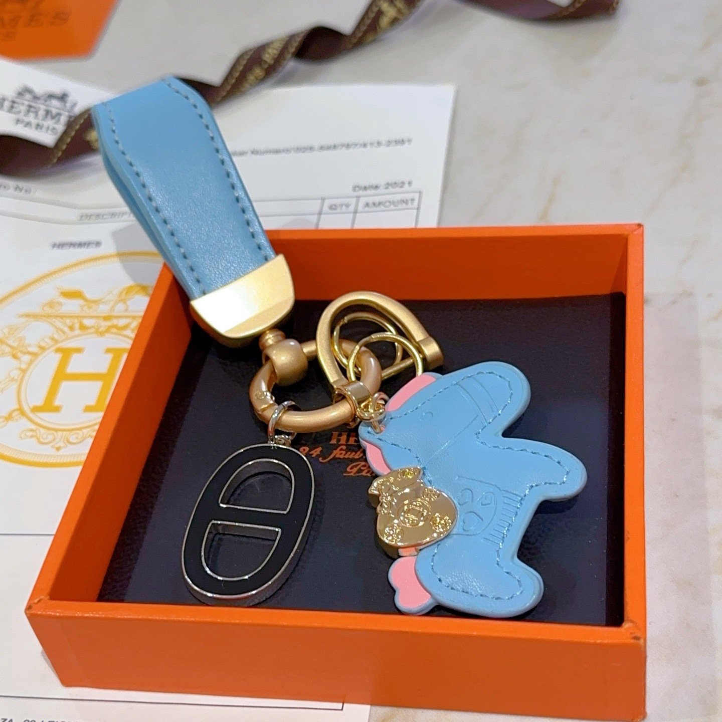 Hermes Rodeo Horse Charm Keychain pendant Light blue leather with pink accents matte gold hardware black and silver Chaine d Ancre charm 10cm total length