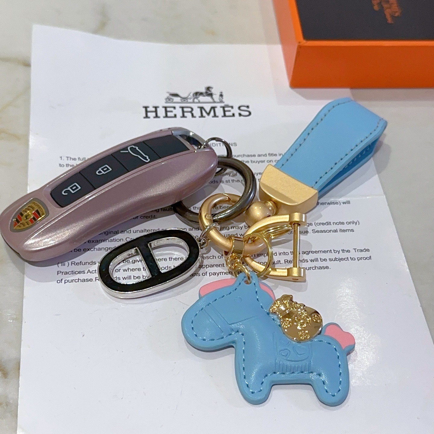 Hermes Rodeo Horse Charm Keychain pendant Light blue leather with pink accents matte gold hardware black and silver Chaine d Ancre charm 10cm total length