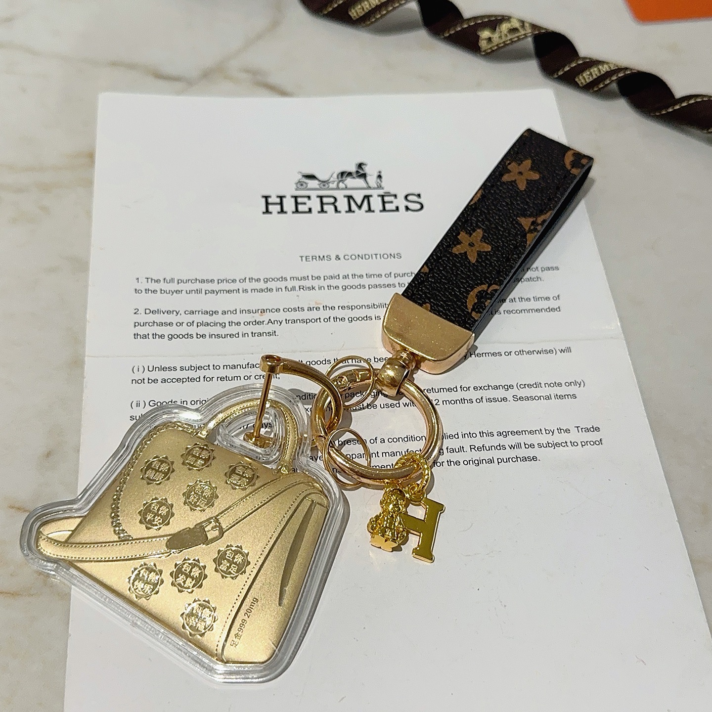 Hermes Bolide Bag Charm Keychain pendant Gold-tone metal dark brown monogram coated canvas clear acrylic casing 12cm total length