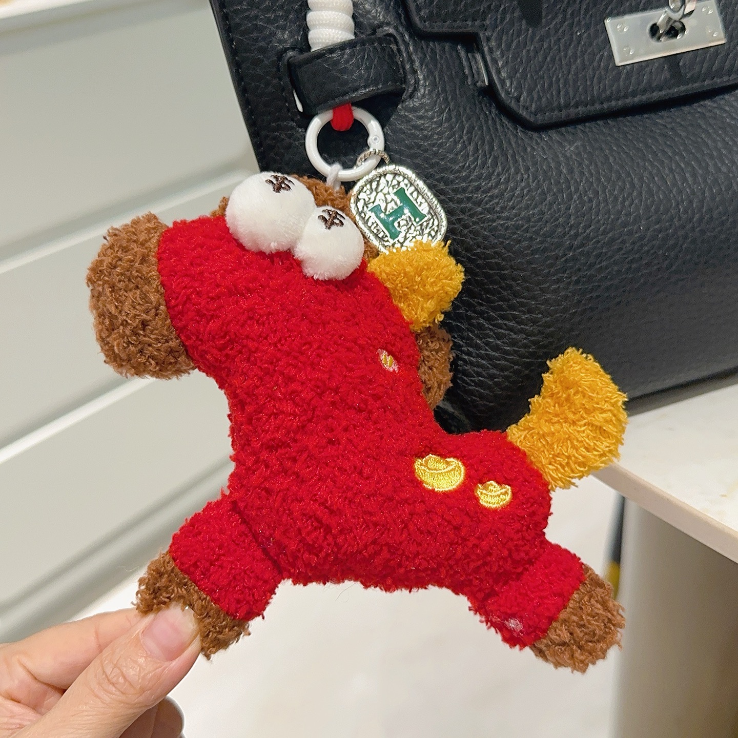 Hermes H Logo Plush Charm pendant Red plush with brown yellow white fabric accents silver-toned metal with green enamel H detail 12cm