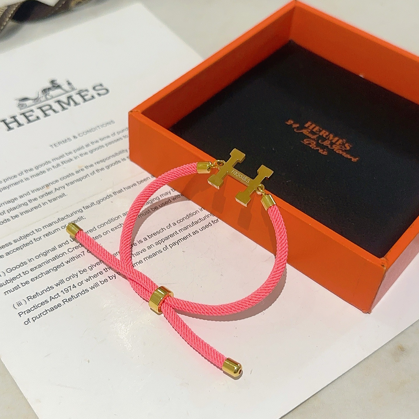 Bracciale Hermes New H in metallo color oro con cordino scorrevole regolabile in metallo color oro, adatto per polsi fino a 19 cm