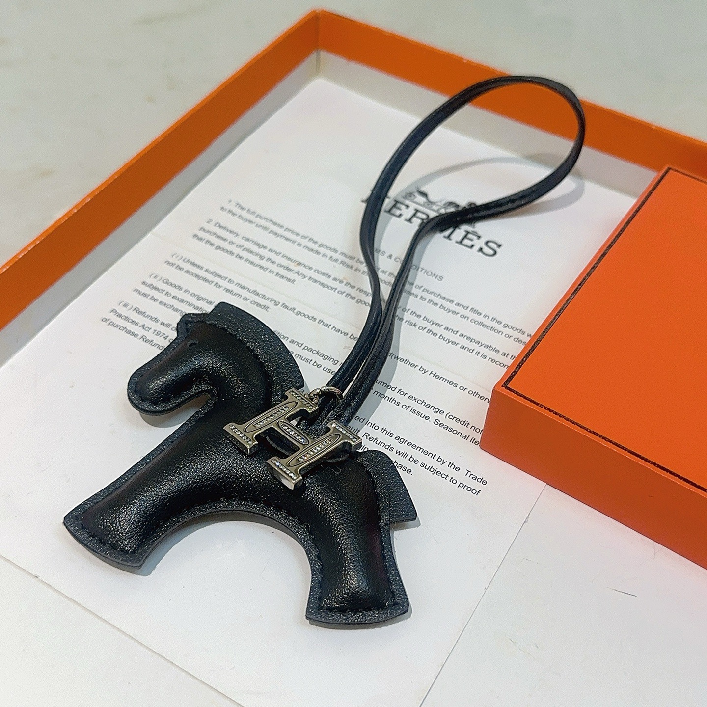 Hermes Rodeo H Charm pendant black leather silver-tone metal with clear crystal accents 80cm