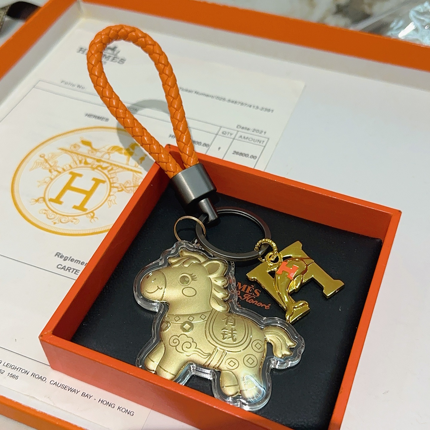 Hermes Lucky Horse H Logo Chaveiro Charme pingente Laranja couro trançado ferragens de metal dourado pingentes de metal com detalhes laranja H invólucro de acrílico transparente 10 cm alça trançada 4 cm