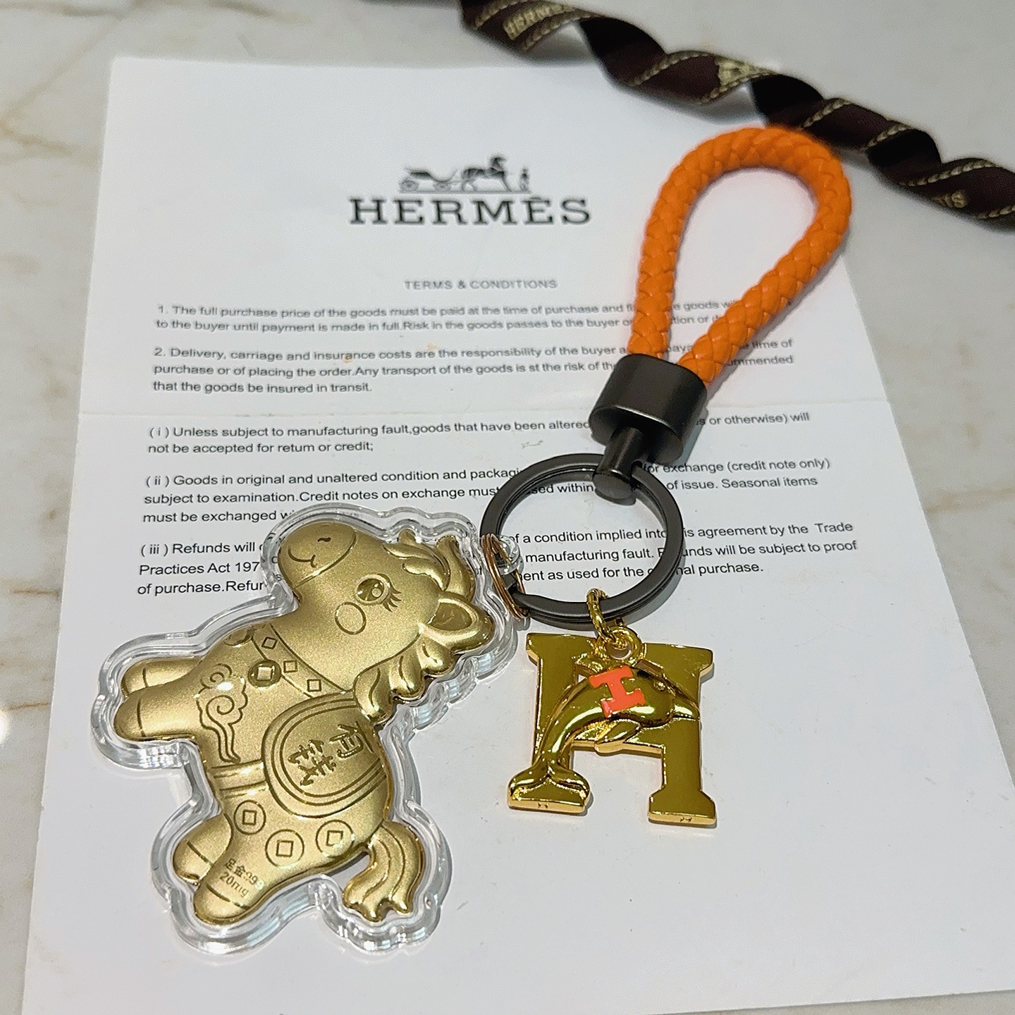 Hermes Lucky Horse H Logo Chaveiro Charme pingente Laranja couro trançado ferragens de metal dourado pingentes de metal com detalhes laranja H invólucro de acrílico transparente 10 cm alça trançada 4 cm