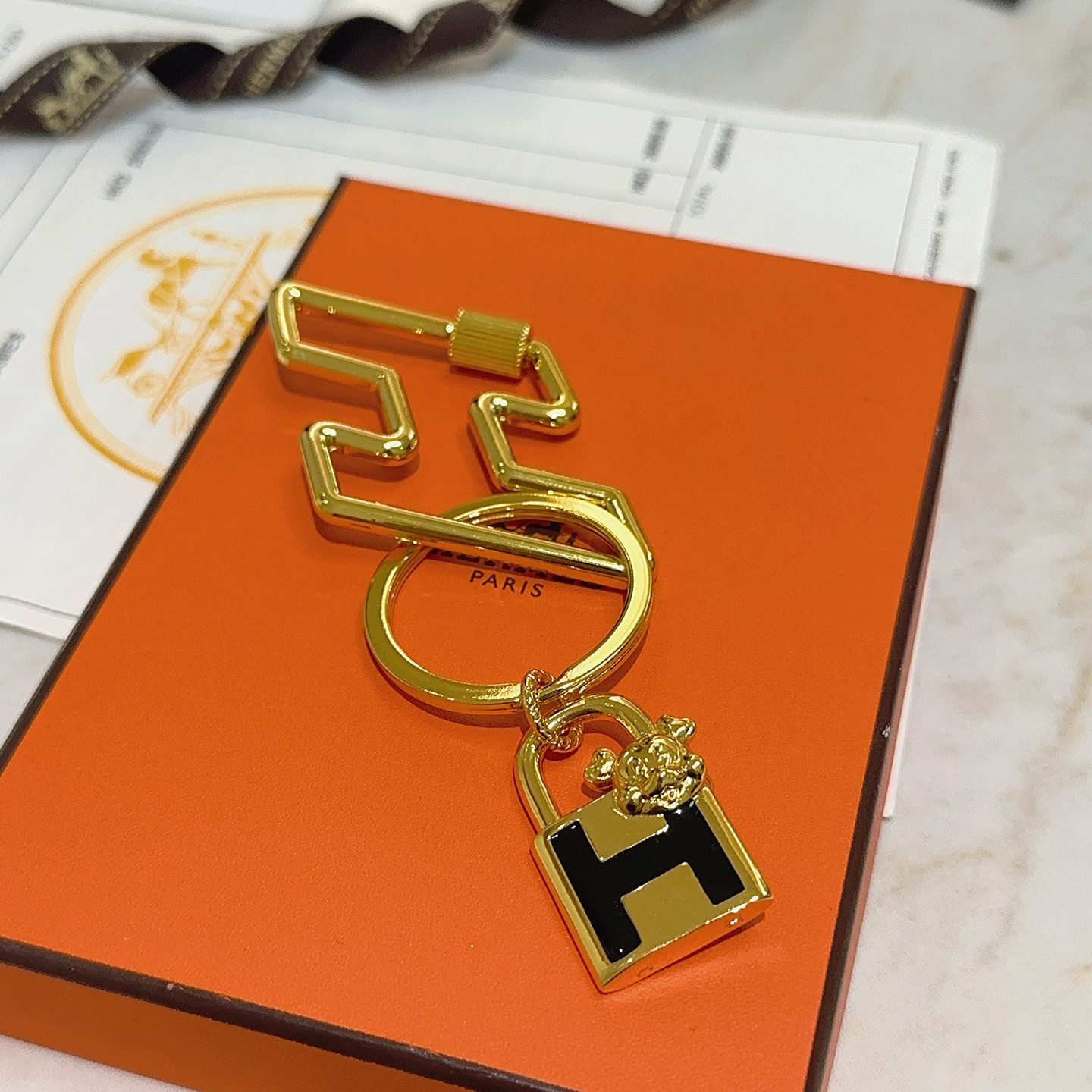 Hermes H Lock Bulldog Charm Keychain pendant gold tone metal with black enamel 8cm total length