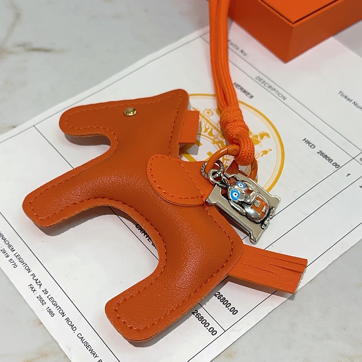 Hermes Rodeo Pegase Horse Charm with H Monkey Pendant pendant Orange leather with silver-tone metal blue and orange enamel accents gold-tone rivet 8cm