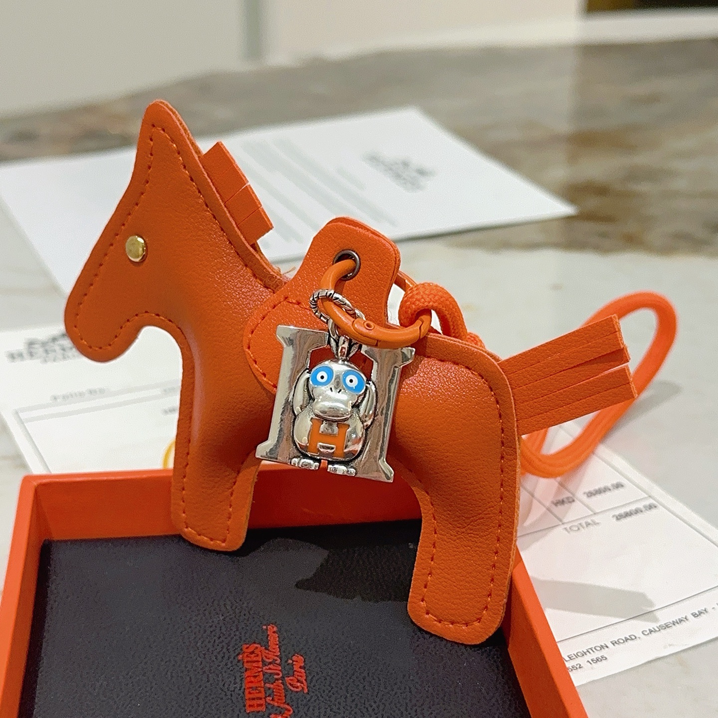 Hermes Rodeo Pegase Horse Charm with H Monkey Pendant pendant Orange leather with silver-tone metal blue and orange enamel accents gold-tone rivet 8cm
