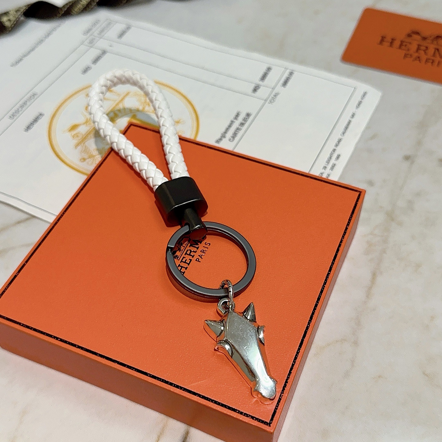 Hermes Horse Head Braided Strap Keychain pendant White braided leather gunmetal gray hardware silver-tone horse head charm 10cm