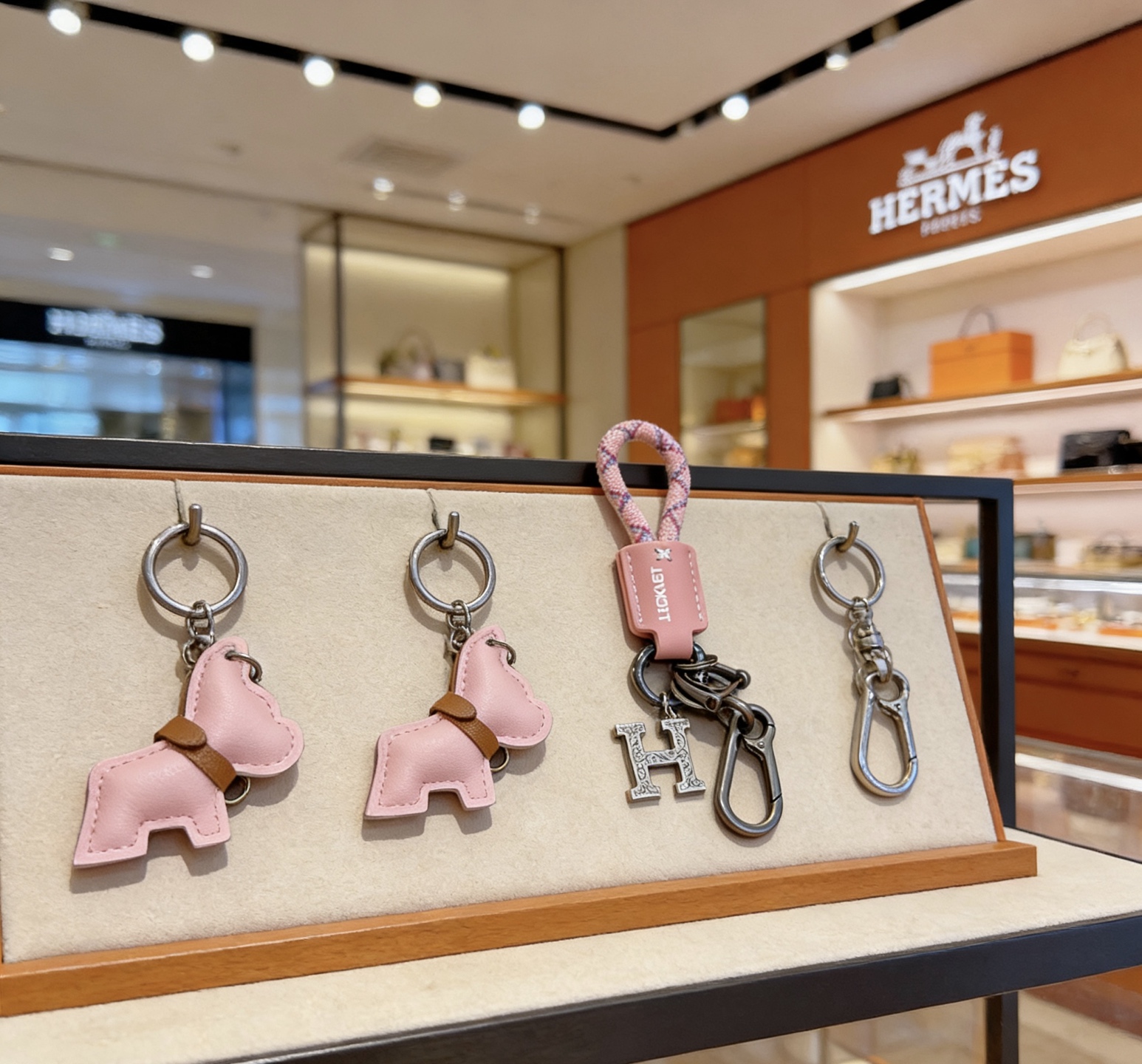 Hermes Buddy H Charm Keychain pendant Gunmetal silver-tone metal light pink leather pink-purple woven cord tan leather accent 10cm total length