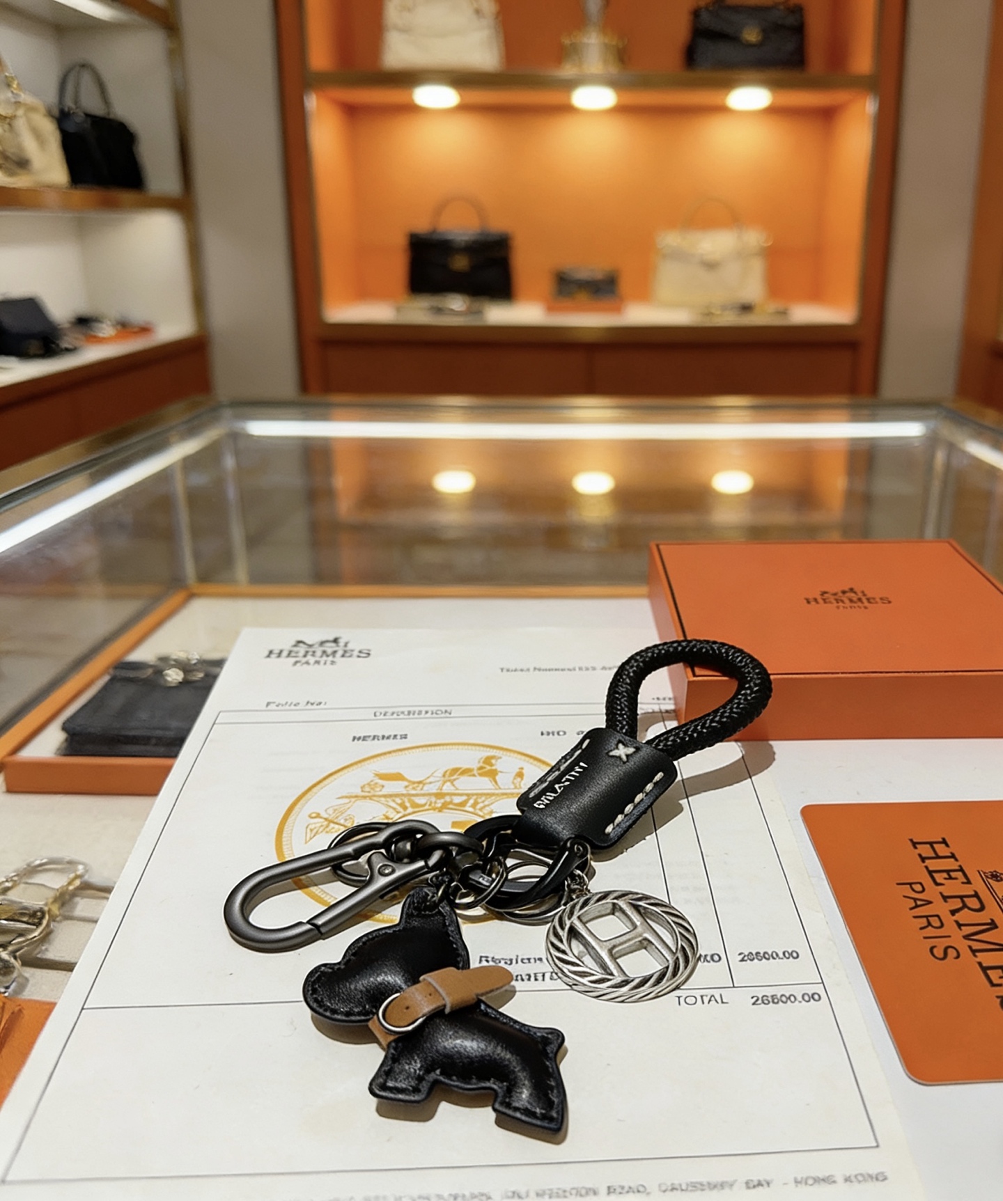 Hermes Bull Dog Charm Porte-clés pendentif Cordon tressé noir cuir noir accent cuir beige matériel argenté bronze à canon 10 cm longueur totale