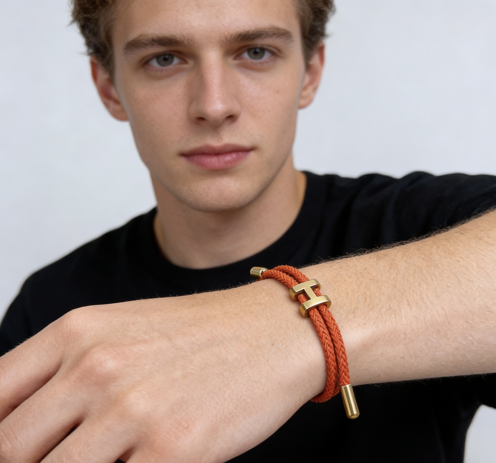 Hermes Tournis Tresse H bracelet Red braided cord gold-tone metal hardware Adjustable sliding cord fits 15-18cm wrist
