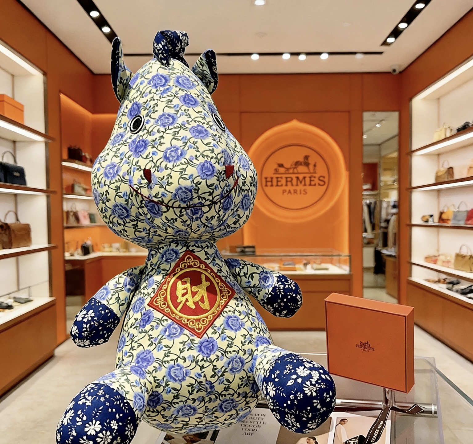 Hermes Hermes Horse Plush Charm pendant Cream fabric with blue floral print red and gold embroidered wealth motif navy blue floral accents 45cm