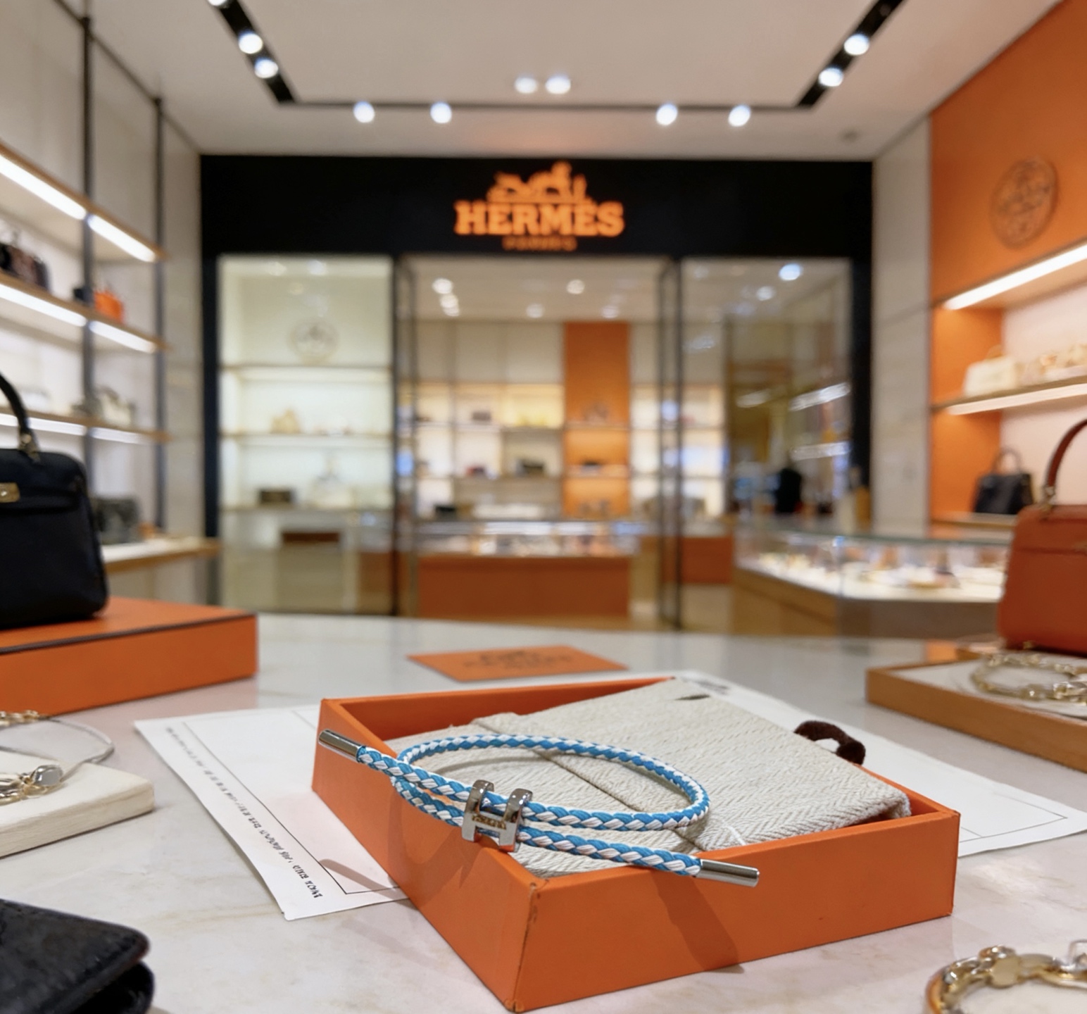 Hermes Tournis Tresse bracelet palladium silver hardware turquoise blue and white braided cord adjustable sliding closure fits 15-18cm wrist