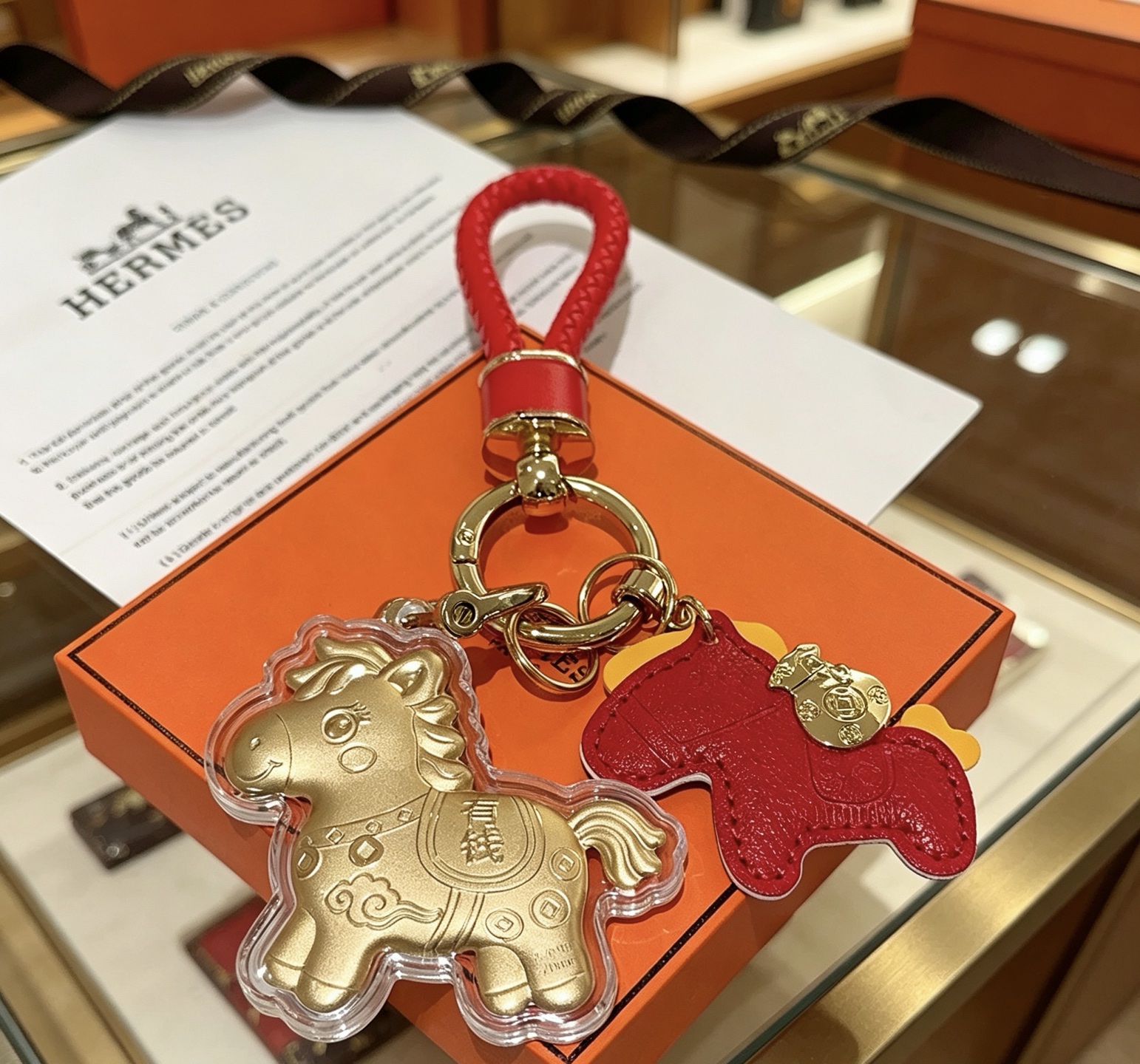 Hermes Lucky Horse Charm pendant Red leather gold-tone metal clear protective casing 10cm total length