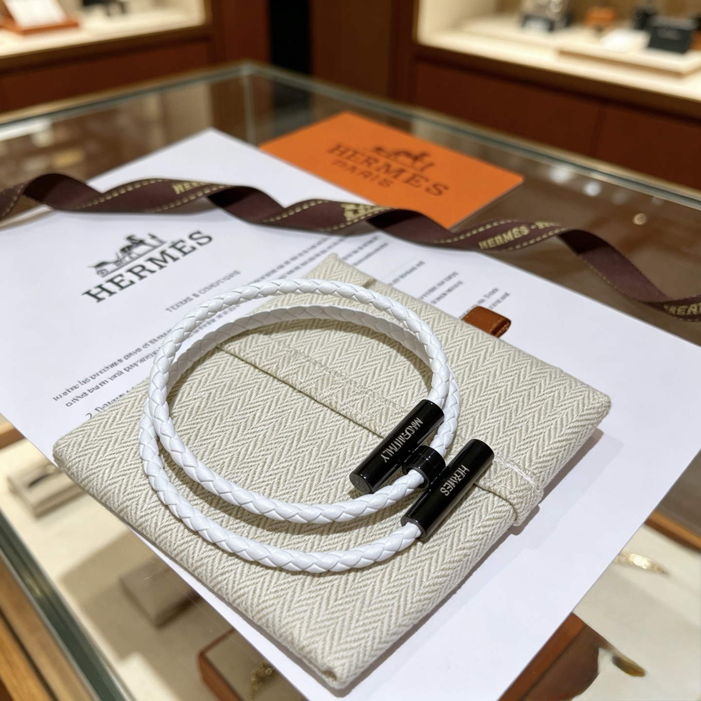 Hermes Tournis Tresse bracelet white braided leather with black hardware 19cm