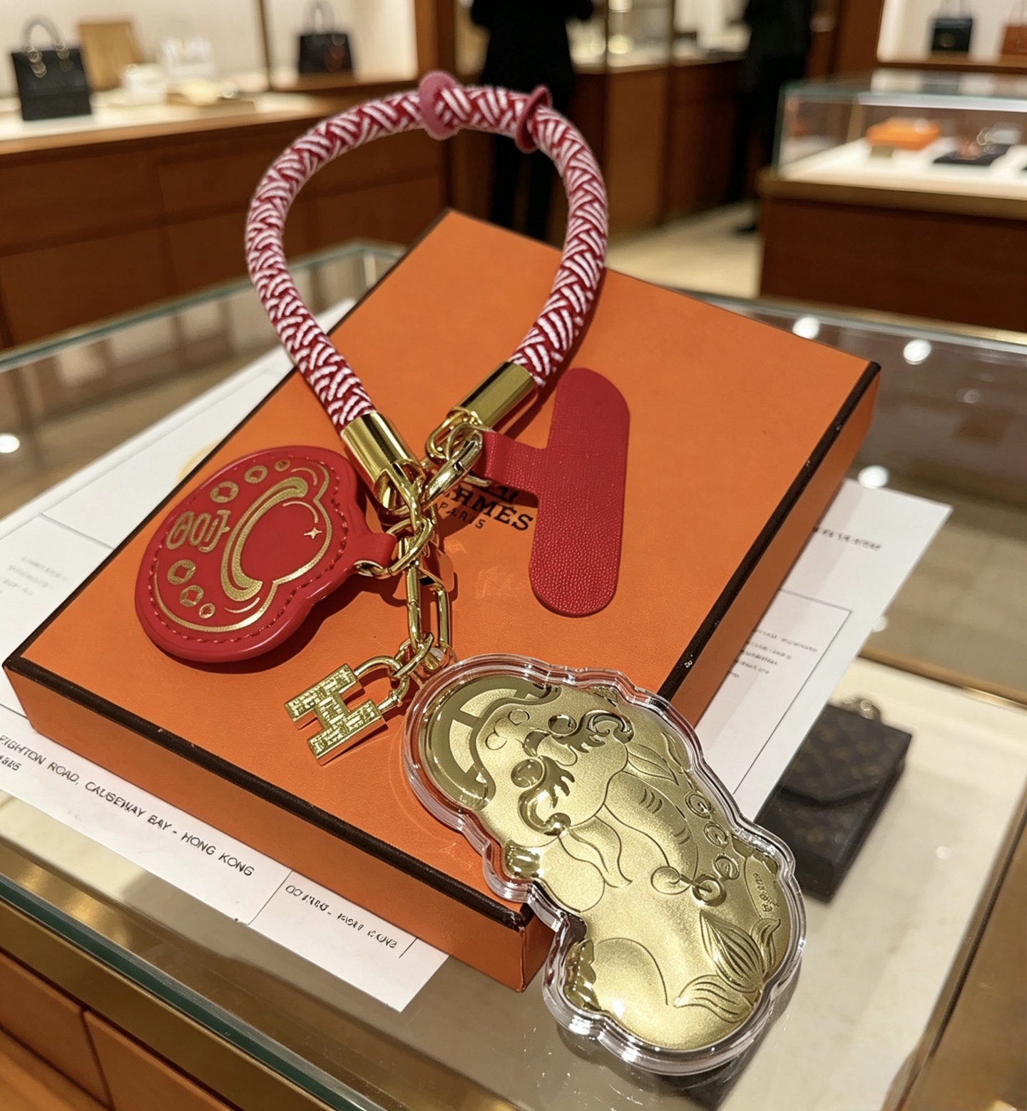 Hermes Lunar New Year Pixiu Key Charm pendant Gold-tone metal red and white braided cord red leather 15cm loop length