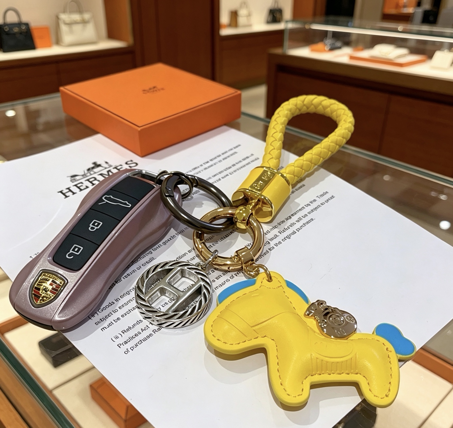 Hermes Rodeo Braided Key Charm pendant Yellow leather with blue accents gold-tone and silver-tone metal hardware 12cm total length