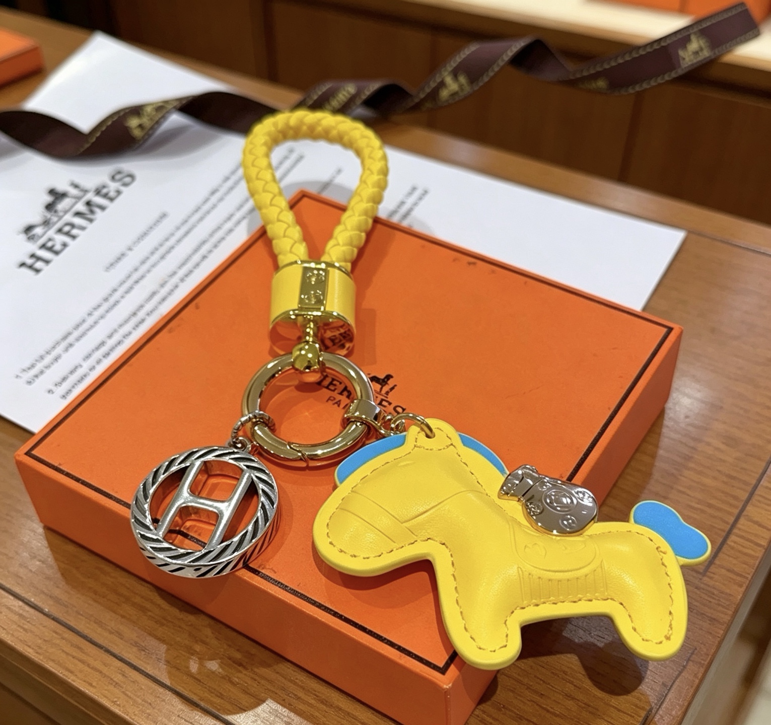 Hermes Rodeo Braided Key Charm pendant Yellow leather with blue accents gold-tone and silver-tone metal hardware 12cm total length