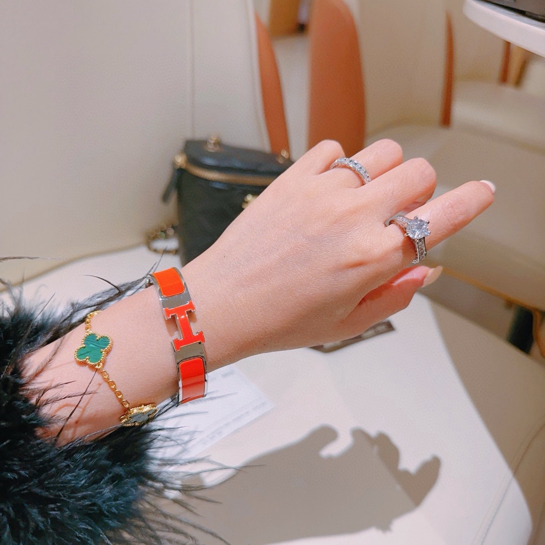 Pulsera Hermes Clic H metal plateado paladio esmalte naranja PM