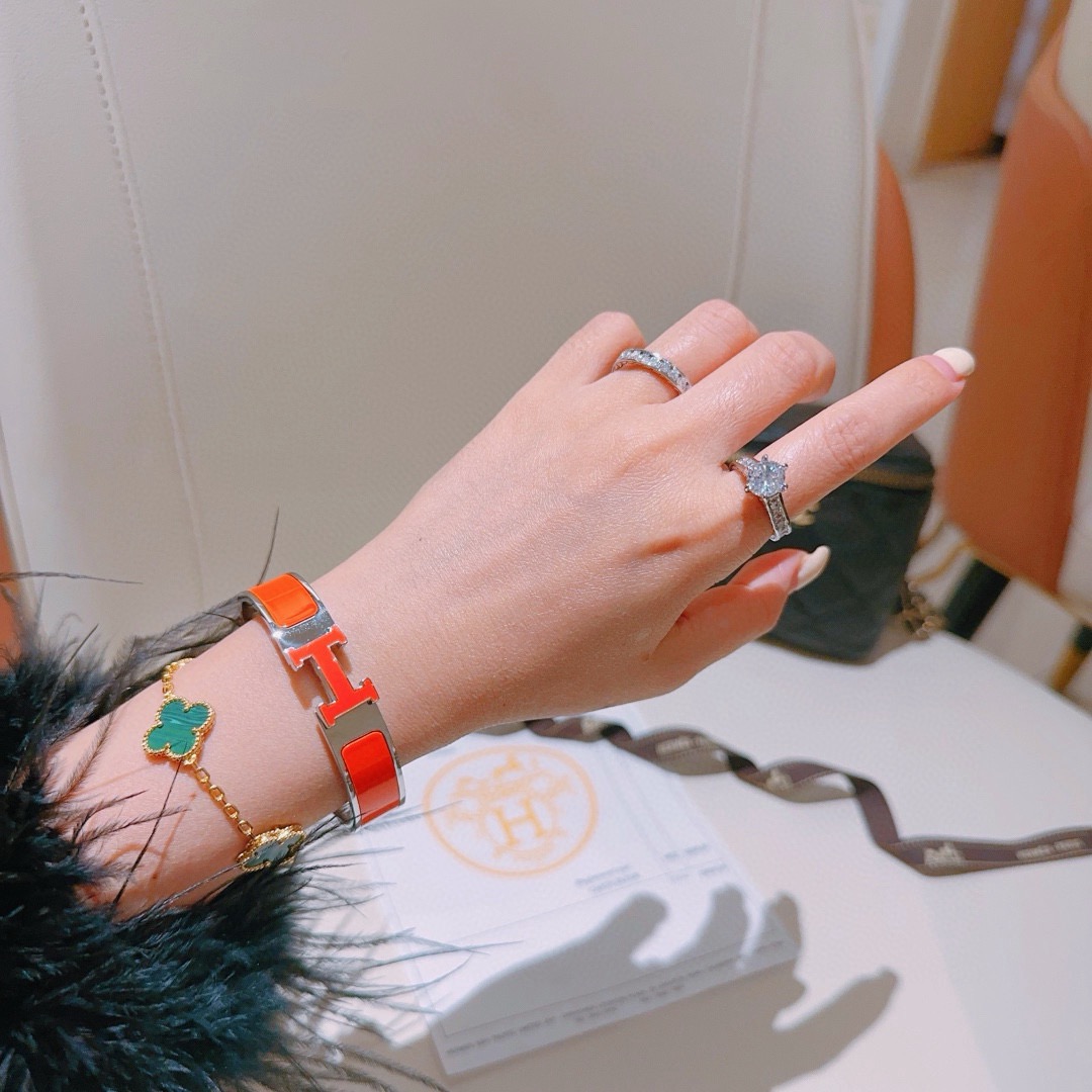 Pulsera Hermes Clic H metal plateado paladio esmalte naranja PM