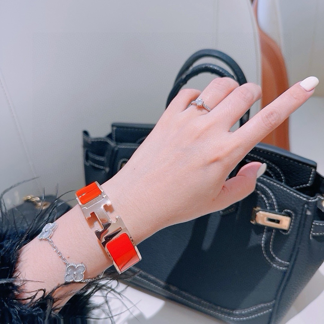 Hermes Clic Clac H bracelet gold-tone metal with bright orange enamel 18mm