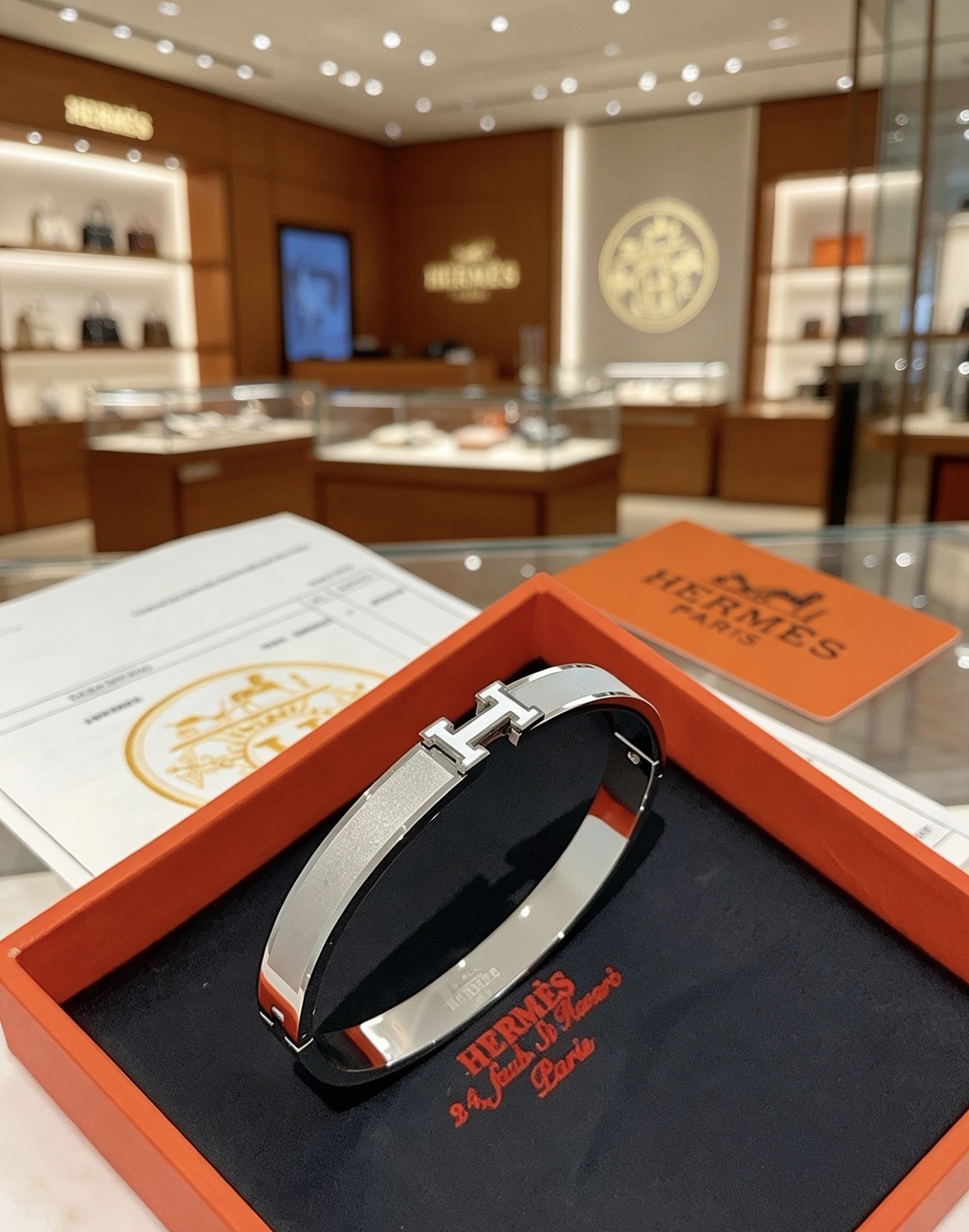Hermès gold-tone bracelet, shown in the complete original source image set. 2